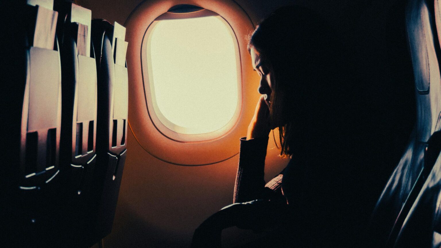 Woman sleeping on plane