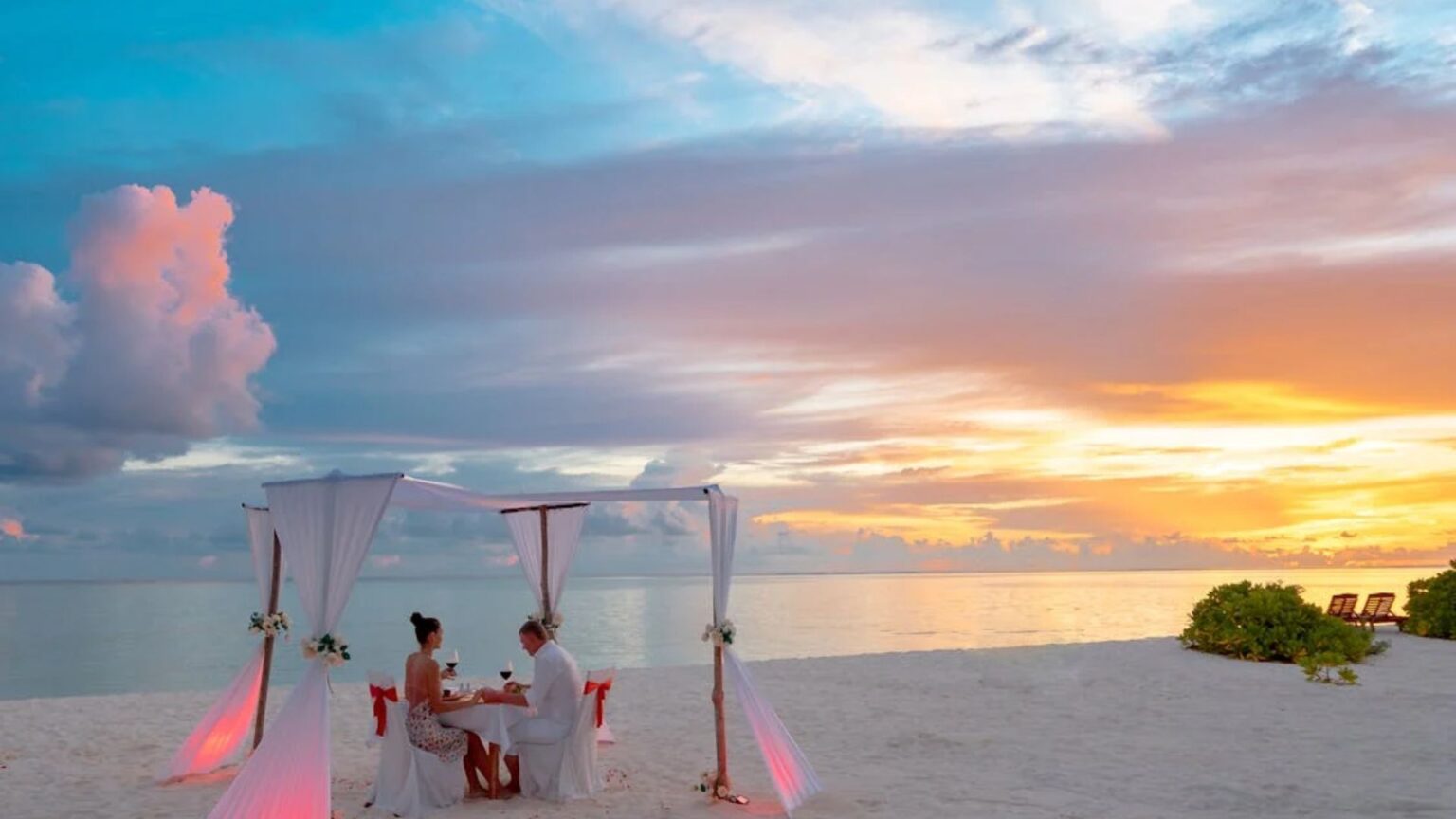 Couple enjoying romantic dinner on the beach