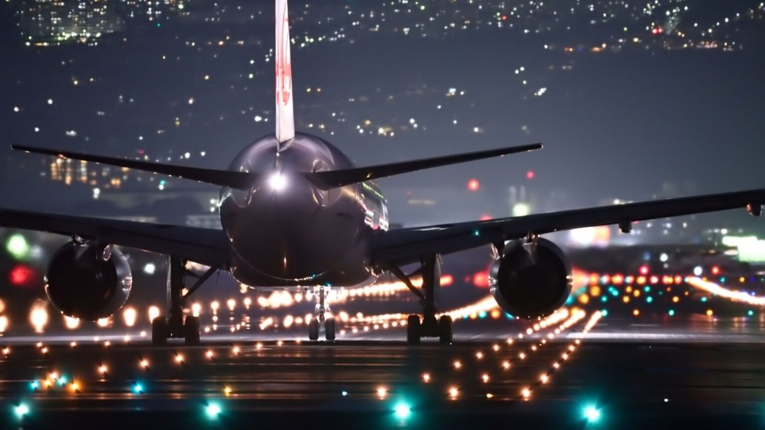 Plane on runway at night